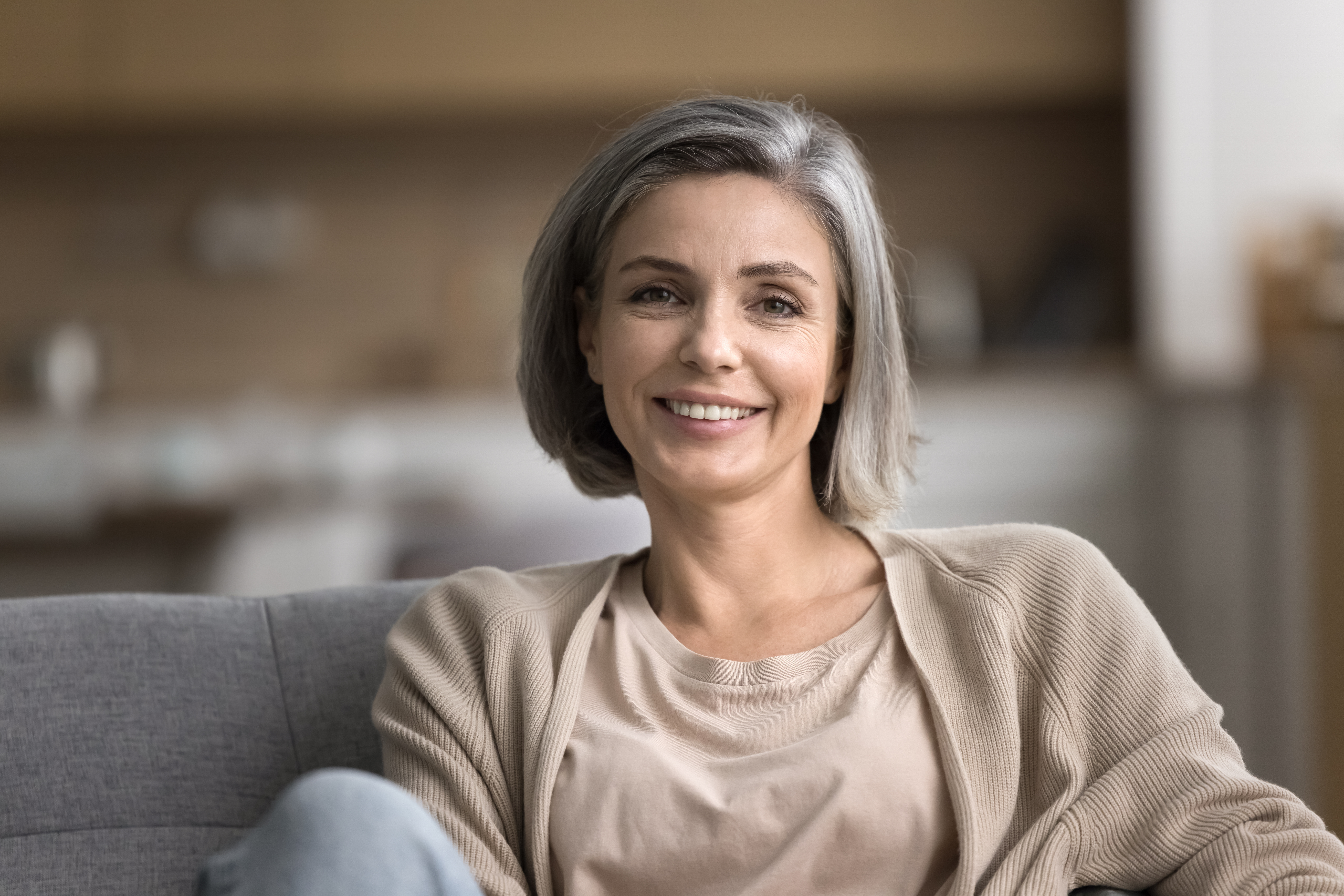 Attractive middle-aged woman smiling looking at camera