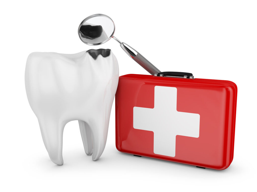 decayed tooth, a dental mirror and a red suitcase with white cross