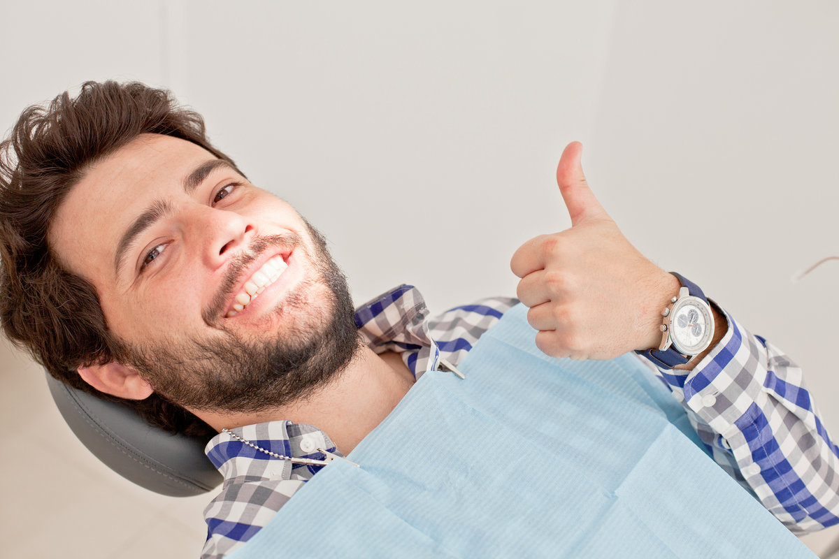 young man and woman in a dental examination at dentist