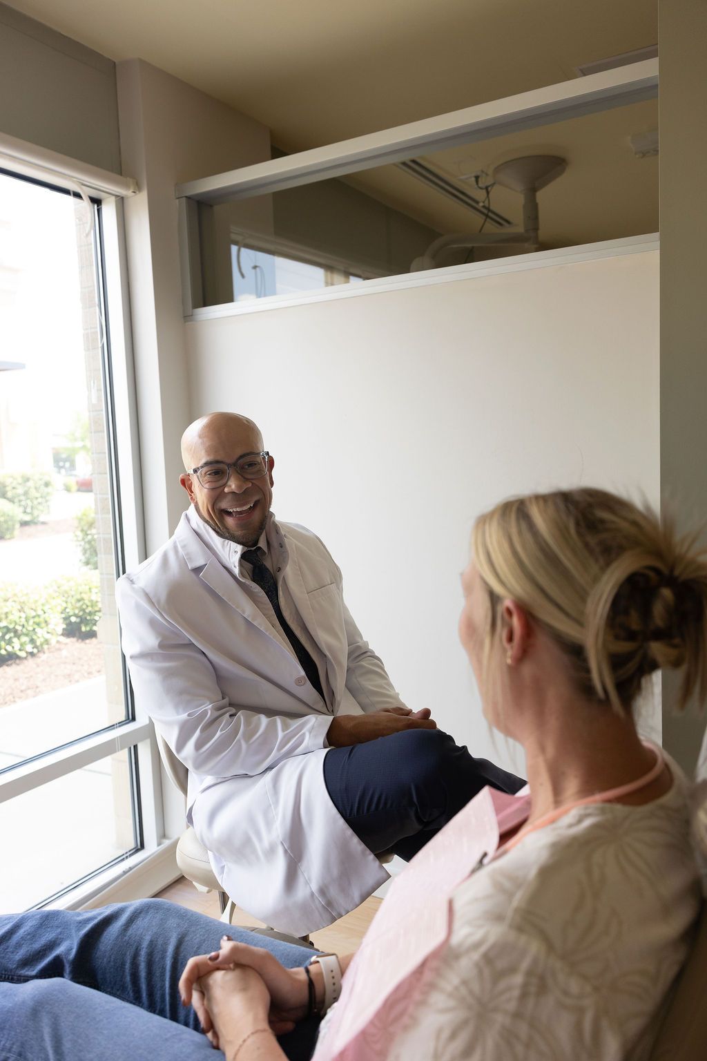 Sunrise Dental Cary dentist discussing treatment with patient in modern office