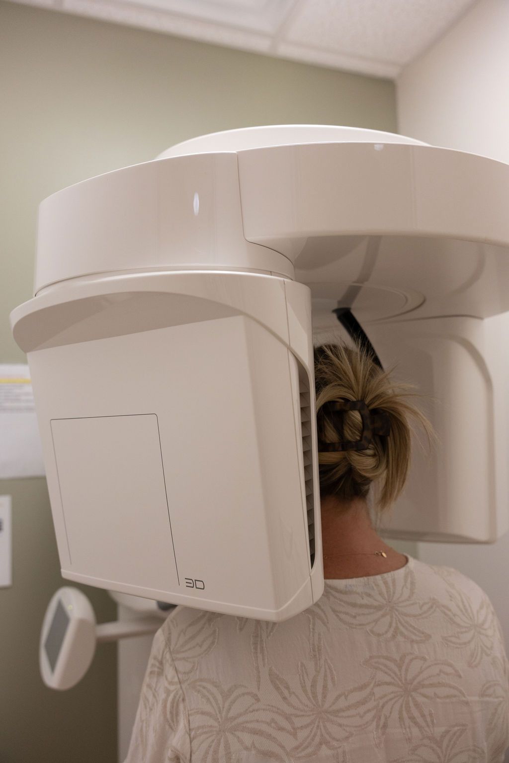 Patient undergoing 3D dental scanner imaging at Sunrise Dental Cary